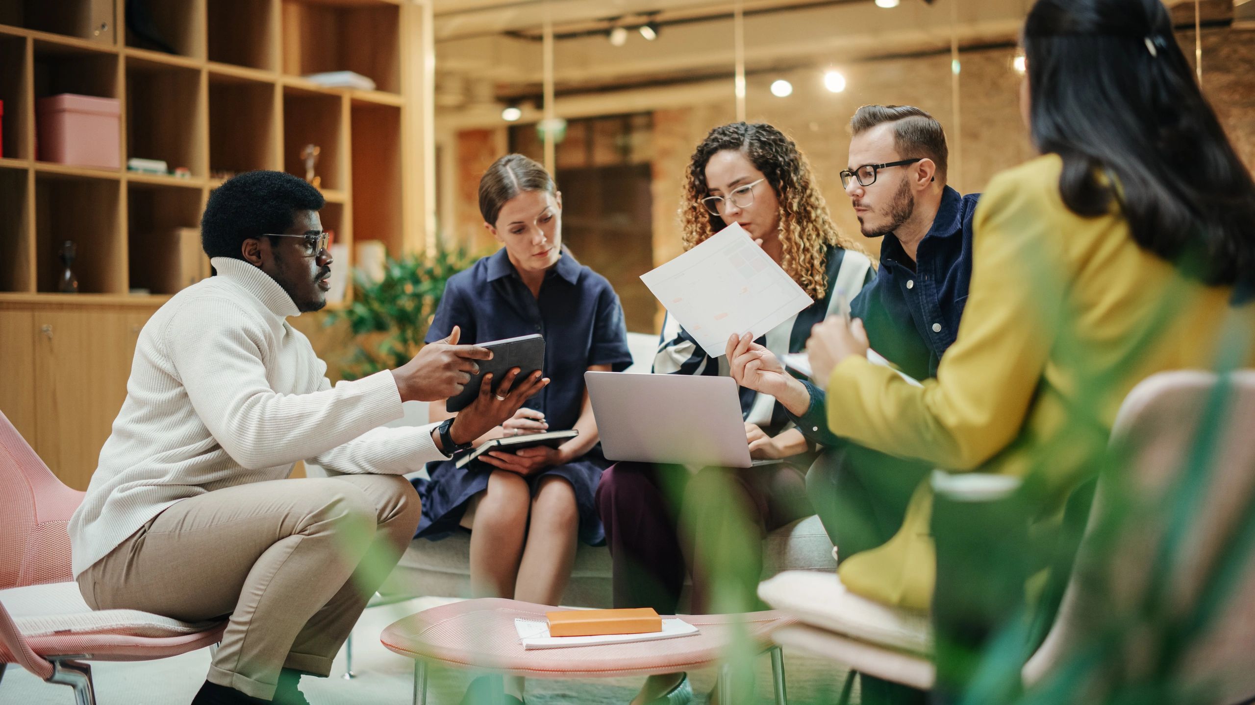 Professional team leader speaking with colleagues in a meeting