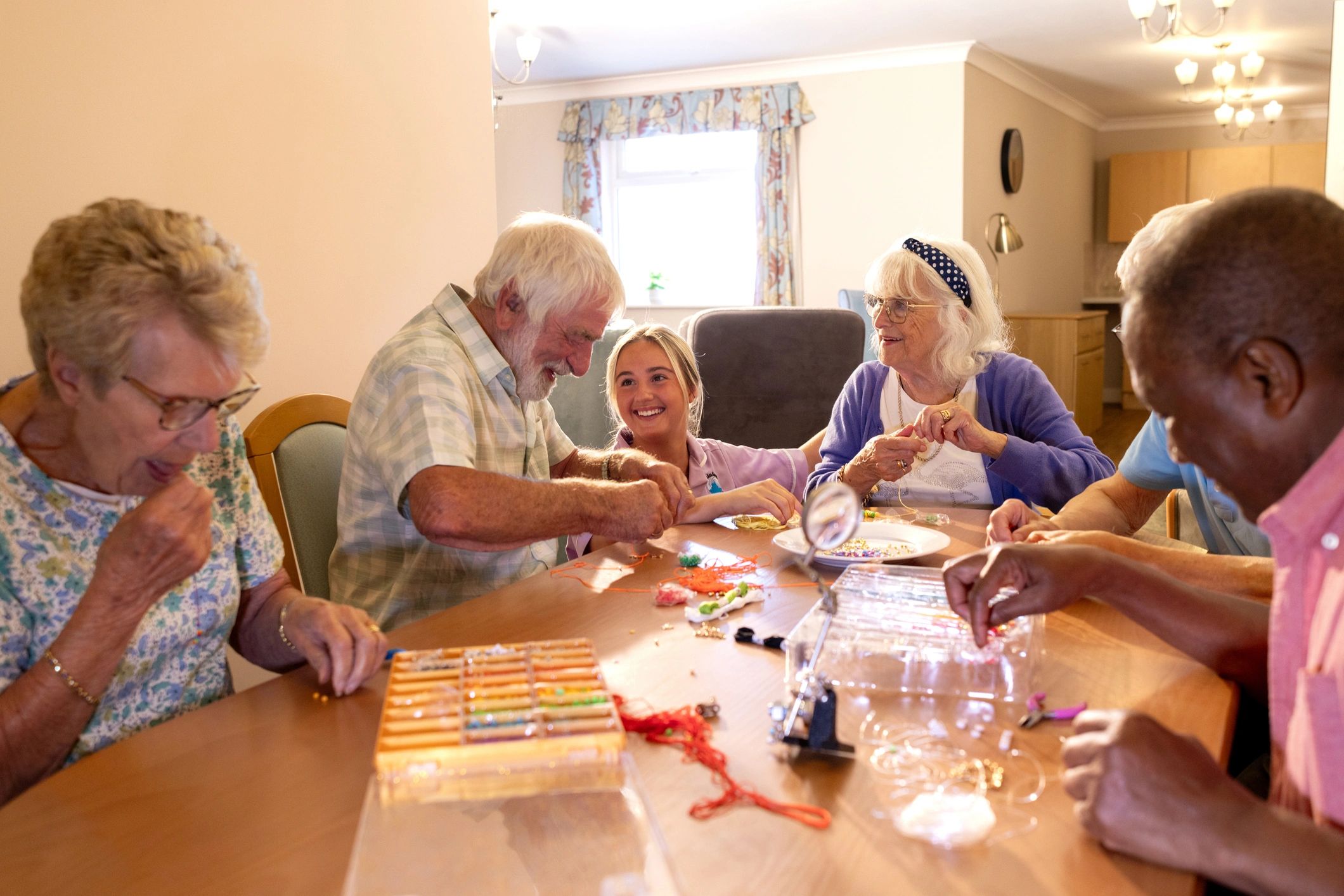 Professional caregiver with seniors in a group setting